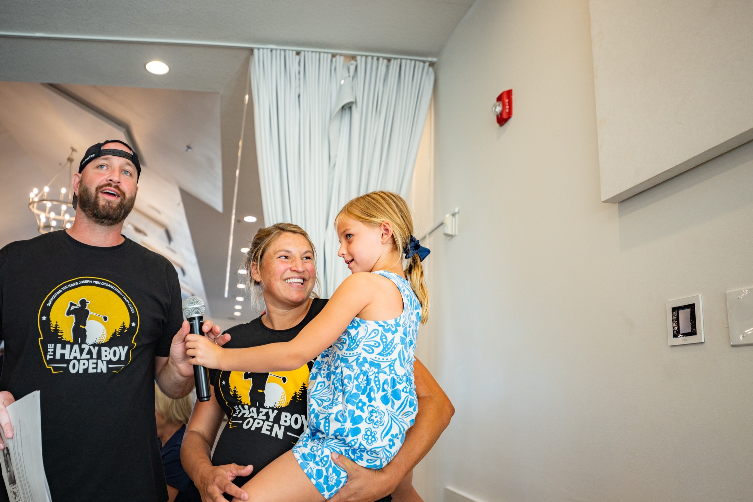 Rob and Kevyn Pien with their daughter at the dinner